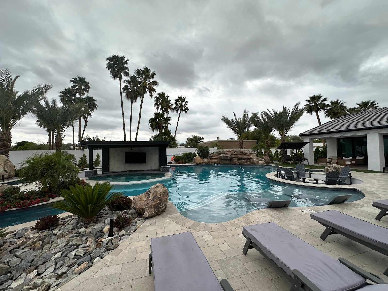 Modern Infinity Pool with Desert Landscaping